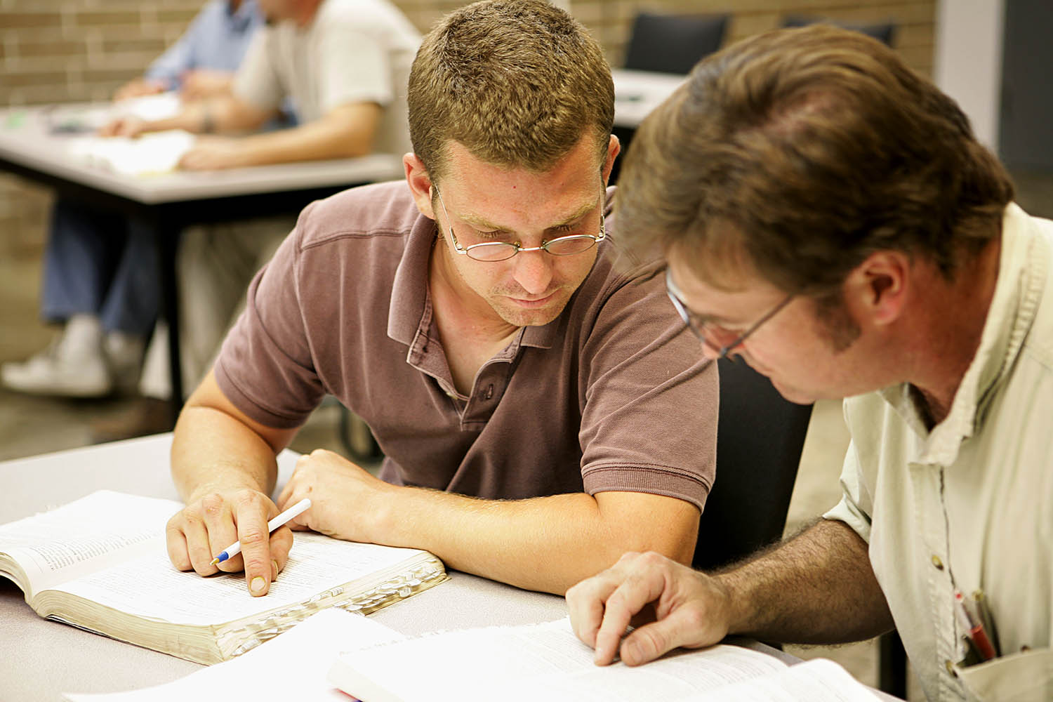 student and teacher studying