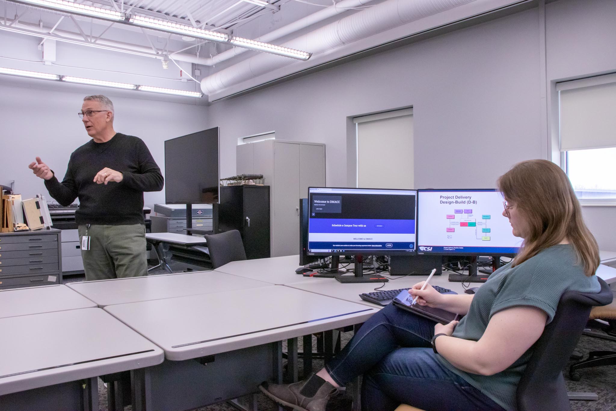 MACC Architectural Technology student Anna Crouse takes notes during class at the Hunziker Center in Ames, where hands-on learning and real-world tools prepare students for careers in the field.