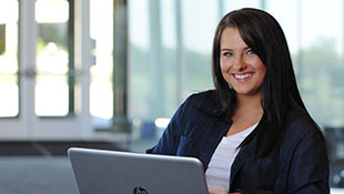 student with a laptop computer