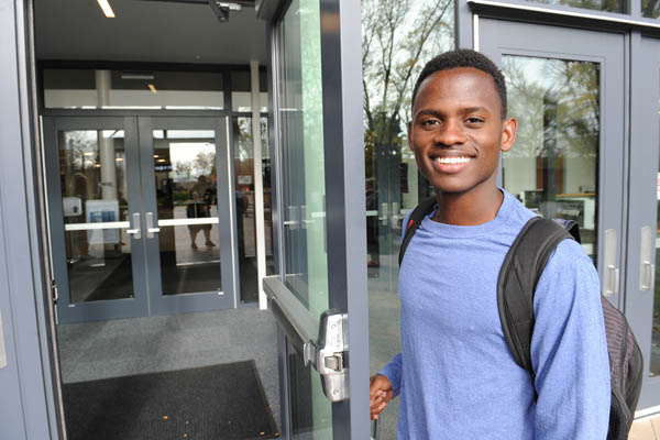 DMACC student opening a door